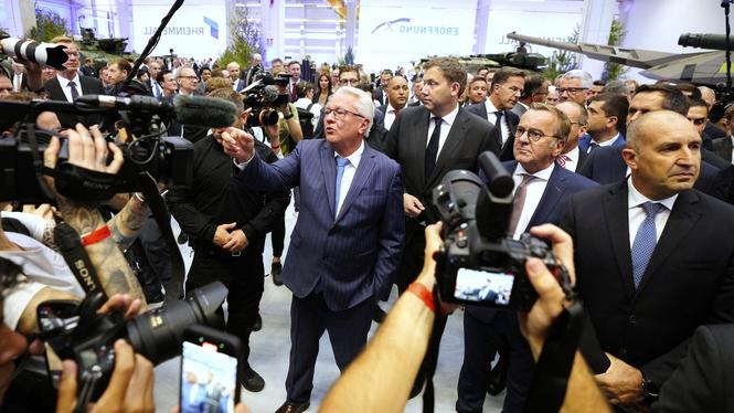Rheinmetall CEO Armin Papperger, center, gestures besides NATO Secretary General Mark Rutte, background right, German Defense Minister Boris Pistorius, foreground right, and German Vice Chancellor Lars Klingbeil,