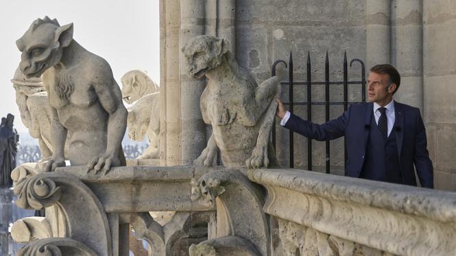 French President Emmanuel Macron attends the inauguration of the towers of the Notre Dame cathedral in Paris, Friday Sept. 19, 2025, which are reopening to the public this weekend. (Yoan Valat, Pool Photo via AP)  MEU106